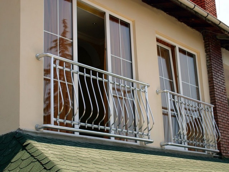 French Balcony in the Modern Interpretation and Decoration. Modern cottage with french balconies at the guest bedrooms