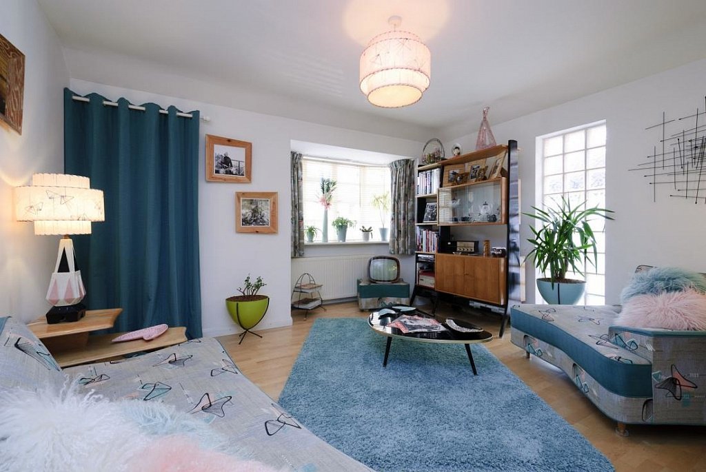 Nice minimalsitic living room with blue carpet