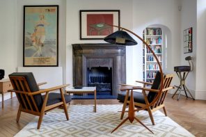 1970s Interior Design Ideas with Photo Examples. Bent large lamp over the sitting zone with black upholstered chairs