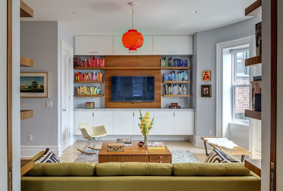 1970s Interior Design Ideas with Photo Examples. Large sitting zone with the green sofa and orange shade