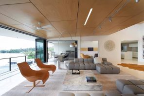 12 Ways You Could Make Your Home More Eco Friendly. Unusual designed modern living room with paneled ceiling, modular sofa, relaxing chairs and marble imitating stand as the coffee table