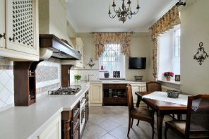 Provence Style Kitchen Interior Design for Cozy Life with Taste of Classics. Typical marvelous French village style with beige curtains and dark wooden fruniture