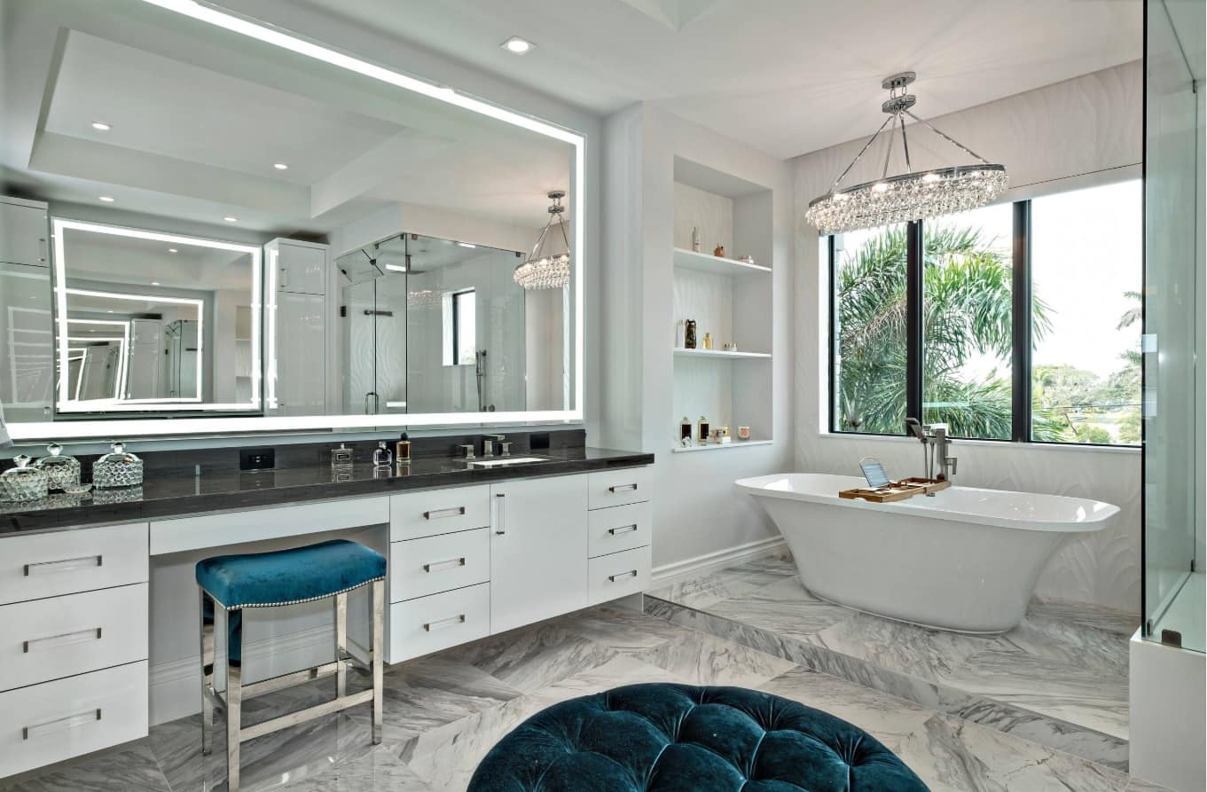 5 Enlightening Benefits of Hanging Lighted Mirrors on your Walls. Large boudoir right at the bathroom with large mirror and circular ottoman