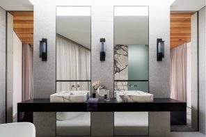 Why Do We Use Wall Sconces. Bathroom in ultramodern hi-tech style with large mirrors