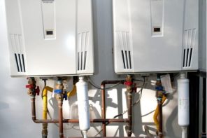 Fixing Home Appliances and Water Heater Maintenance. Double water heater outside the house