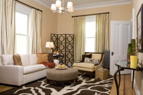 Transitional Style Interior Decoration Ideas for Different Room. Contrasting rug for casual living room with round ottoman