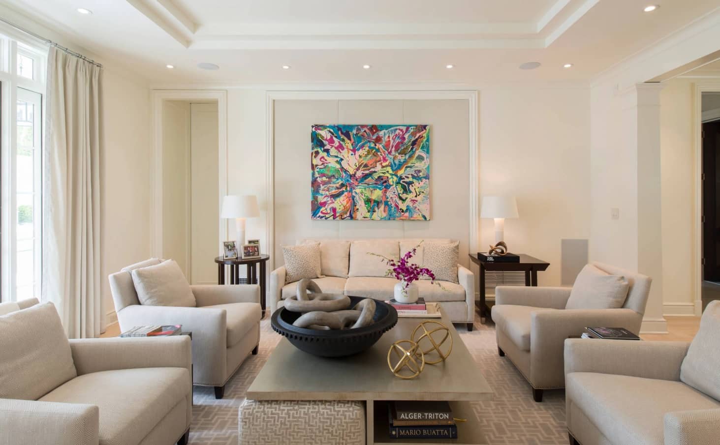 Things to Consider when Renovating A Home. Gorgeous Transitional style living with armchairs and overall gray palette with picture to rejuvenate the atmosphere