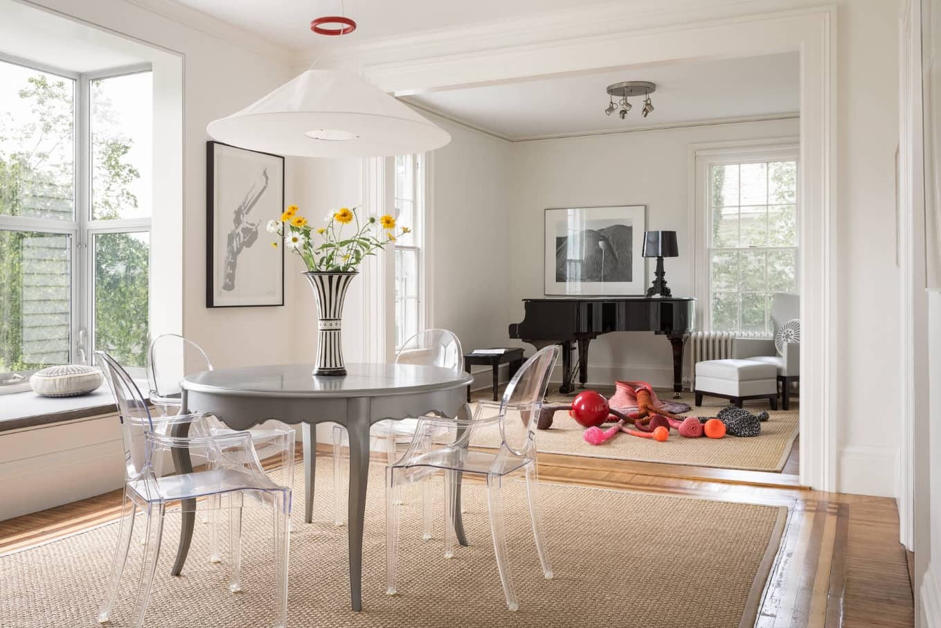 Gray Wood Round Dining Table to Complete the Breathtaking Dining Room. Classic interior with grand piano and large space scale