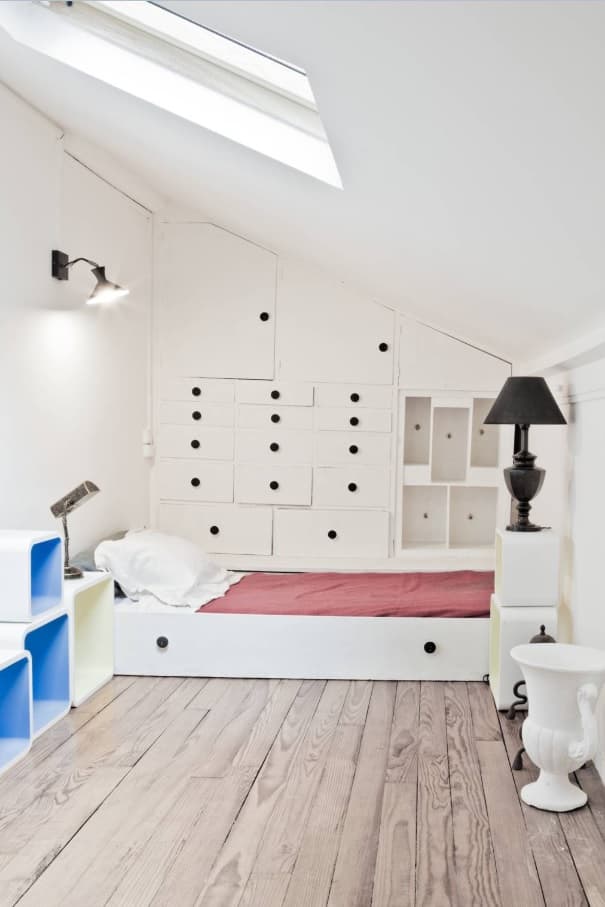 Tips To Get Your Guest Room Ready. Lots of storage boxes for modern men's cave with skylight and black lamp