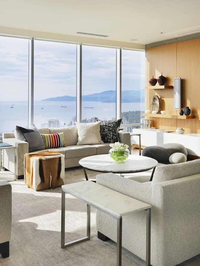Marble Side Table for Modern Interior Design: Complement Your Home. Open layout skyscraper apartment with light grey finishing and similar tone furniture