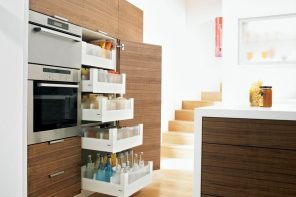 Organizing Kitchen Storage Systems and Pantry for Ultimate Comfort. Great designed pantry near the microwave compartment for modern wooden facaded kitchen