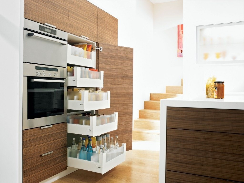 Organizing Kitchen Storage Systems and Pantry for Ultimate Comfort. Great designed pantry near the microwave compartment for modern wooden facaded kitchen