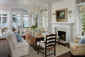 Great Classic design in light pastel color theme for the dining room with wooden chairs and artificial gypsum decorated fireplace