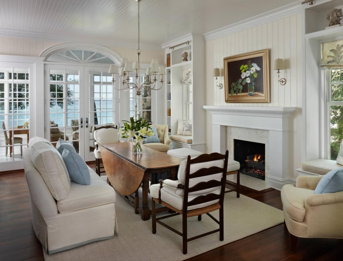 Great Classic design in light pastel color theme for the dining room with wooden chairs and artificial gypsum decorated fireplace