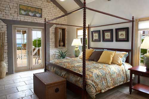 Arts and Crafts Interior Design: Origins and Perspectives of the Style. Canopy bed with carved frame and the simple chest of drawers at the legboard