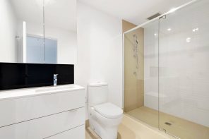 Why Compact Toilets Are Best for Small Bathrooms. Light modern styled room with glass zoned shower