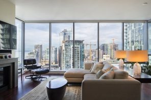 5 Reasons Why Choosing a Luxury Condo is the Best Way to Live in Downtown Seattle. great urban outside view from the panoramic windows of modern open layout apartment