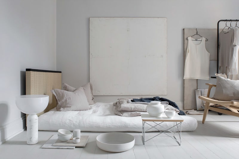 Exotic Wabi Sabi Interior Design Style: Beautiful Minimalism. Ascetic white bedroom with floor mattress