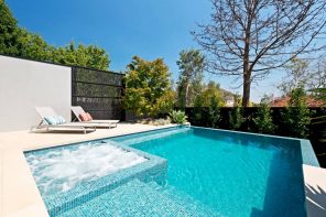 How To Maintain Your Pool Effectively. Great modern backyard design with the sunbathe zone and jacuzzi in the pool