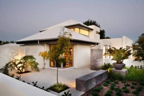 5 Significant Reasons For Maintaining Your Roof Regularly. White modern house with hip and valley roof type and neat concreted yard