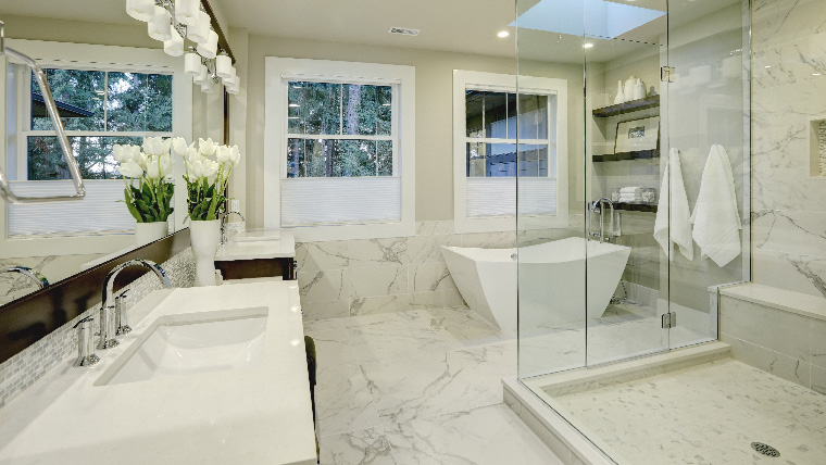 7 Genius tips to deep clean a bathroom. Great bathroom interior design in light marble color and boundless glass shower cabin