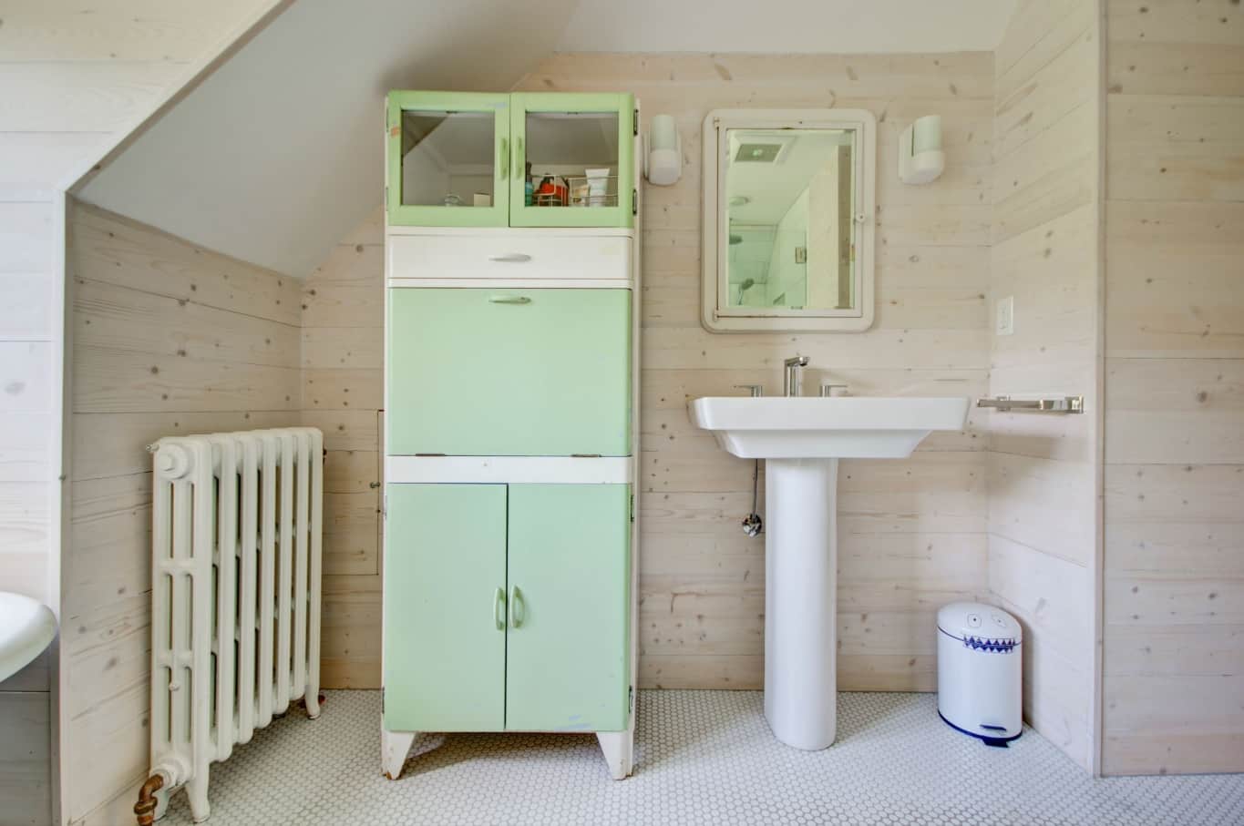 9 Great Bathroom Design Trend for 2020 and Beyond. Mint cabinet and wooden trimming for retro space