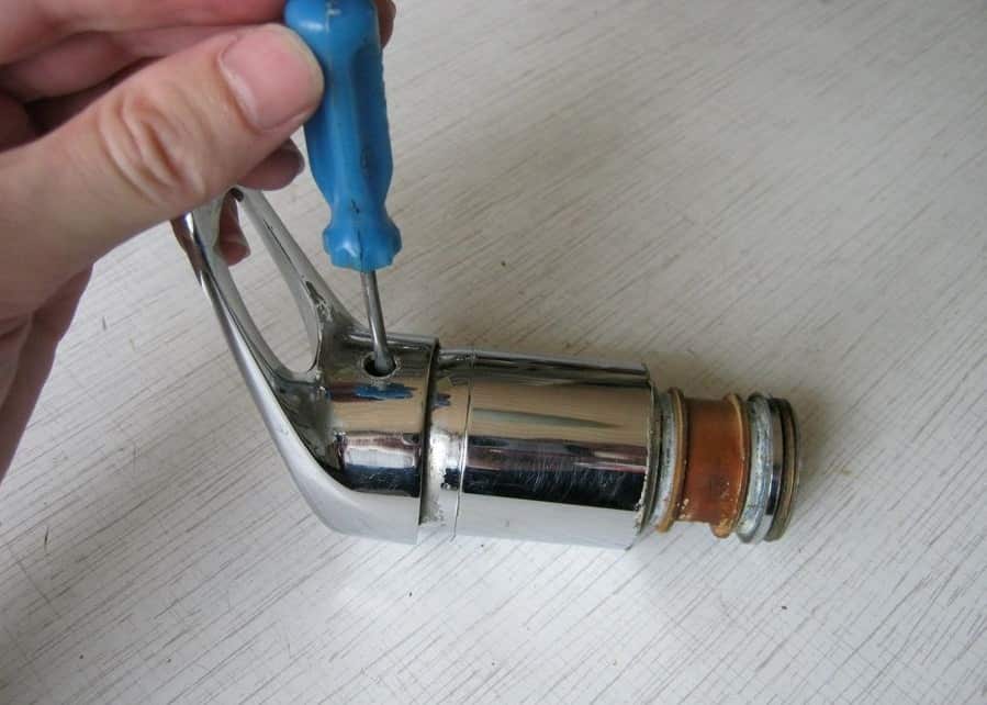 How to Disassemble Kitchen Faucet and Change Its Cartridge. Unscrewing the top lever