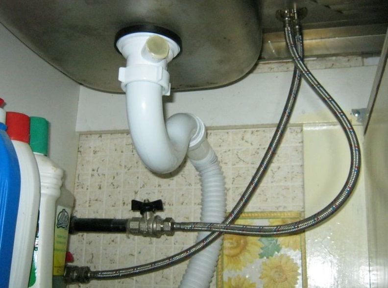 Kitchen Sink Faucet Leaking at Base: Diagnostics and Troubleshooting. The hoses and drainage under the sink