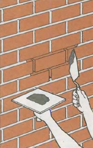 Masonry Pointing: Joints Recovery to Spalling Brick Repair. Seam recovery with mason's trowel