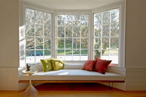 Expert Tips On Taking The Pain Out Of Window Cleaning. Big sash bay window in typical American style house with the sleeper at the windowsill