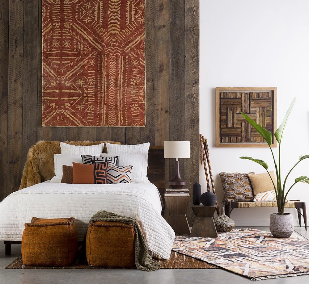 Simple interior design with the wood planked headboard and rug in the bedroom