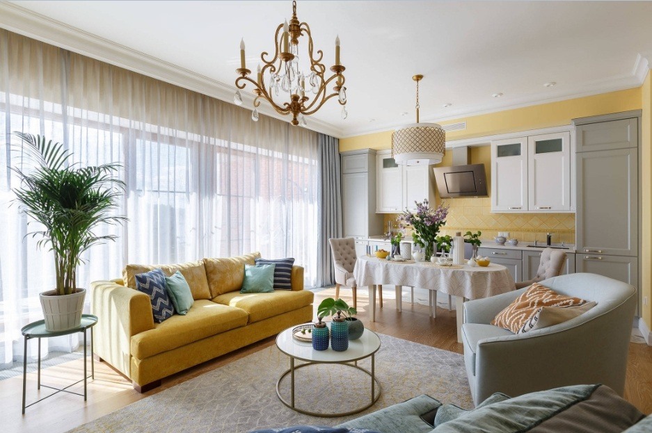 Unusual golden inlays in decoration of the Classic living room interior with huge tule-shaded windows