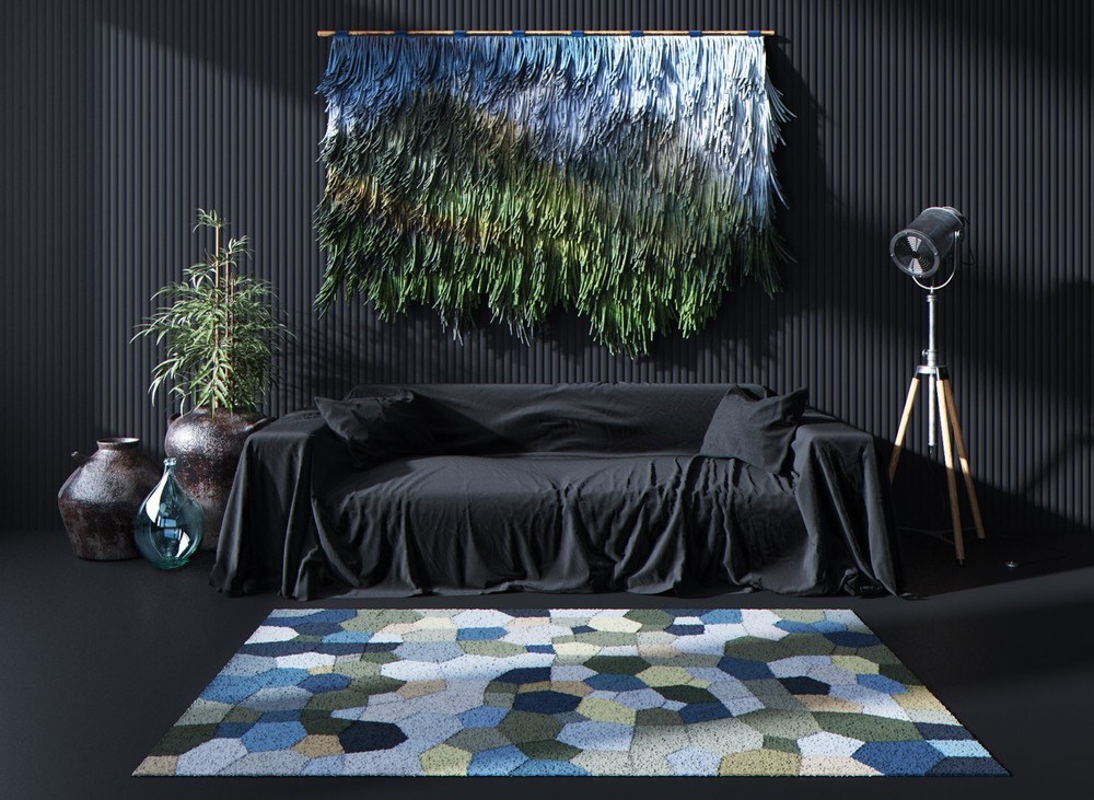 Dark colored bedroom with green and blue carpet at the headboard