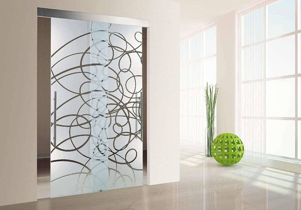 Peculiar lines on the glass door and green elements as the modern decoration for the light and spacious studio apartment
