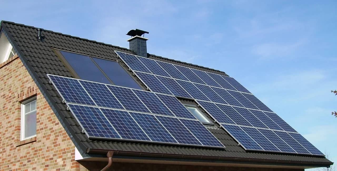 Why Going Green Can Help Sell Homes Faster. Roof with bunch of installed solar panels