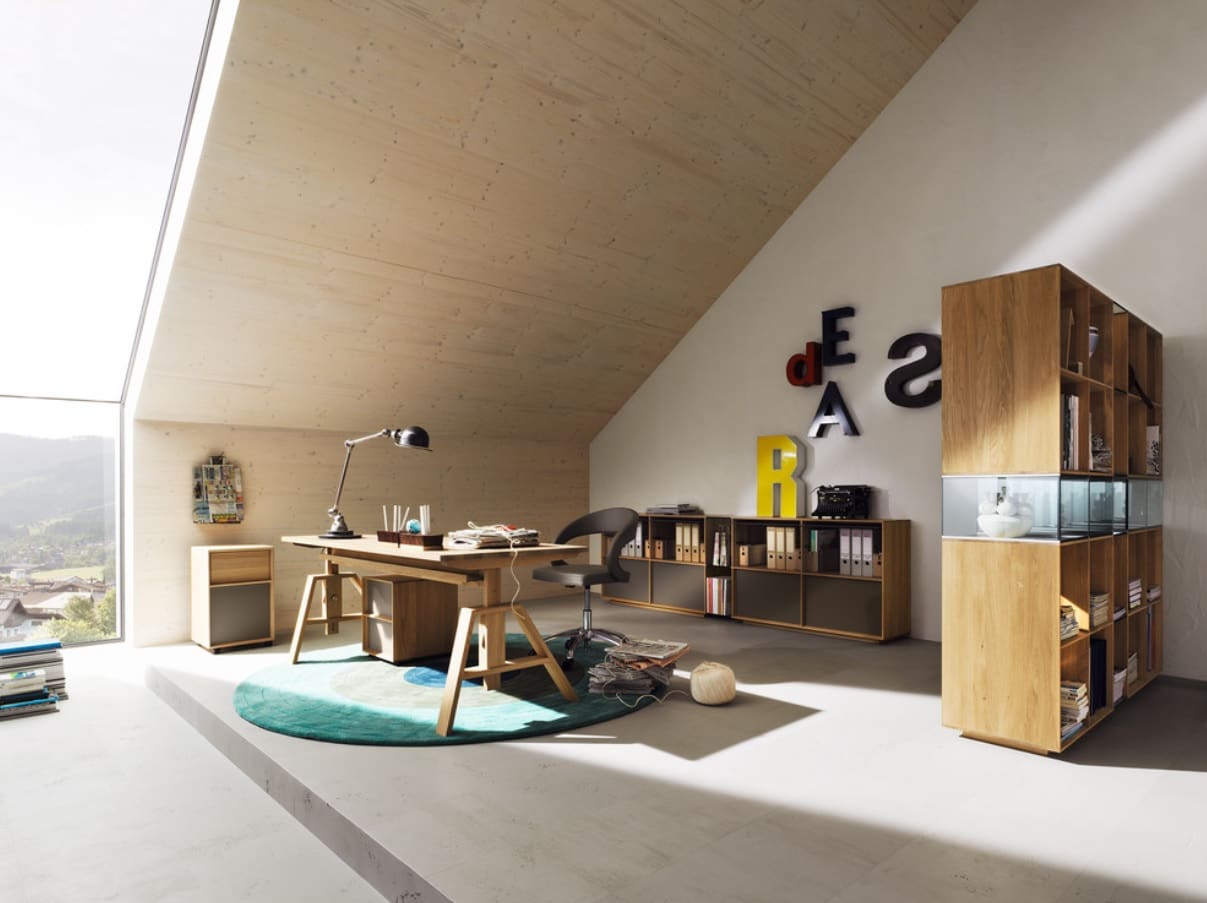 Adjustable Desk to Make Your Home Office more Universal. Mild warm color palette in loft room with wooden furniture