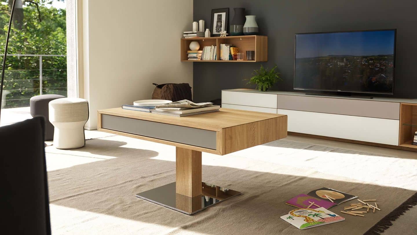 Great modern designed wooden adjustable desk as a coffee table