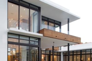 Cantilever Balcony to Enhance the House Facade Design. Great modern design of the steel-and-glass made house full of natural light and with light finishing