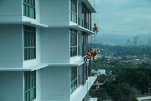 Home Maintenance Checklist 2020. Cleaning windows on scaffold