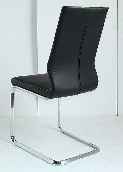 Modern Leather Dining Chairs to Complement the Interior. Chrome steel C-shaped frame and black top