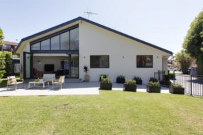 Almost symmetrical gable roof of the peculiarly designed cottage