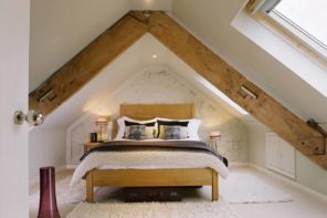 8 Best Loft Conversion Ideas for 2020. Chic lof bedroom with exposed wooden beams