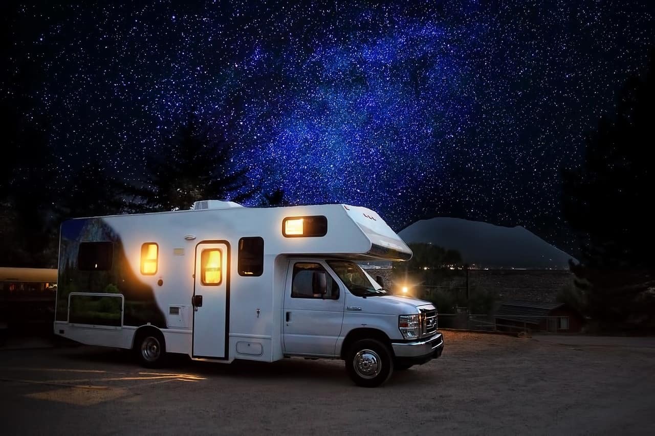 Outdoor Must-Haves for Your Tiny Home. Caravan house with the starry sky background