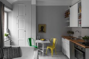 10 Tips on Remodeling Kitchens for New Homeowners. Gray wall and colorful chairs for small dining area