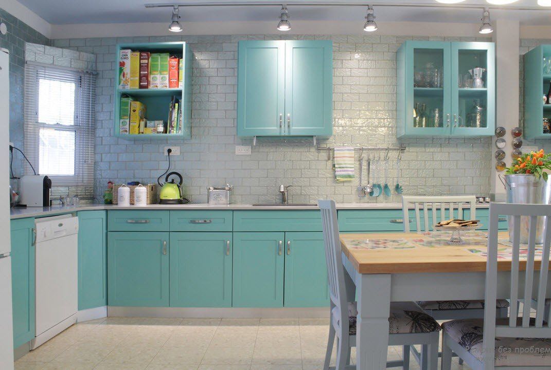 Nice casual designed kitchen with light wooden floor and turquoise furniture