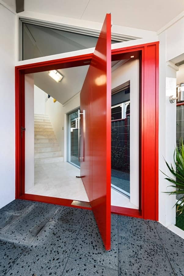 Red swivel front door of the modern styled house