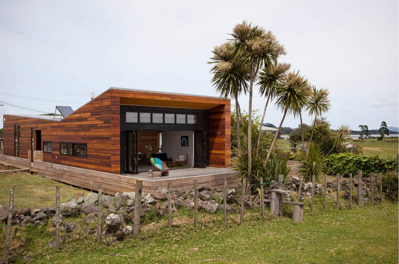 Wooden trimmed modern cottage at the rocky foundation