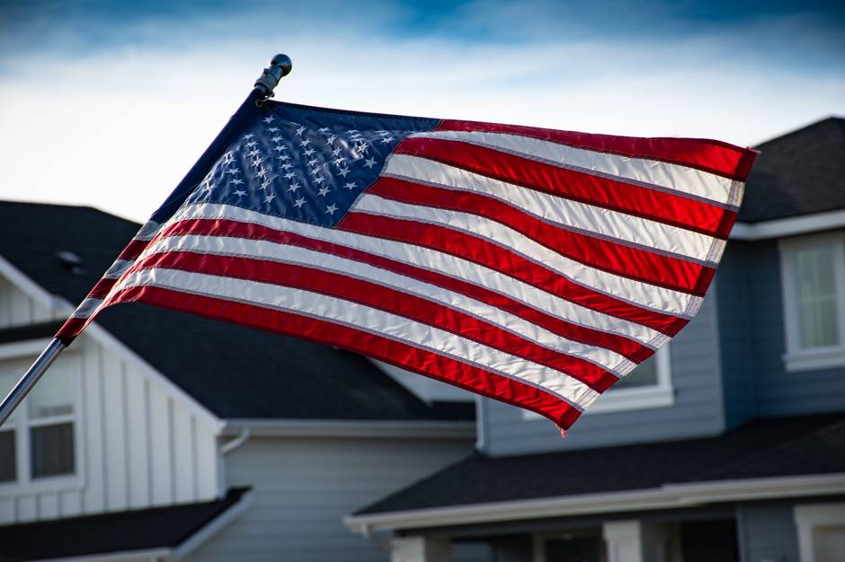 How to Hang an American Flag: The Complete Homeowner's Guide. Flying flag in front of the house