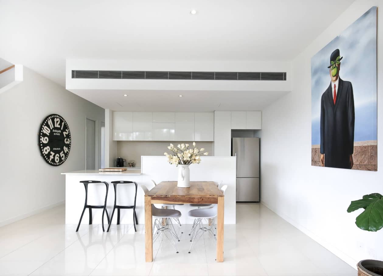 Why Changing Your Air Filters More Regularly Can Improve Your Home's Atmosphere and Cleanliness. Speckless white colored kitchen interior with large island