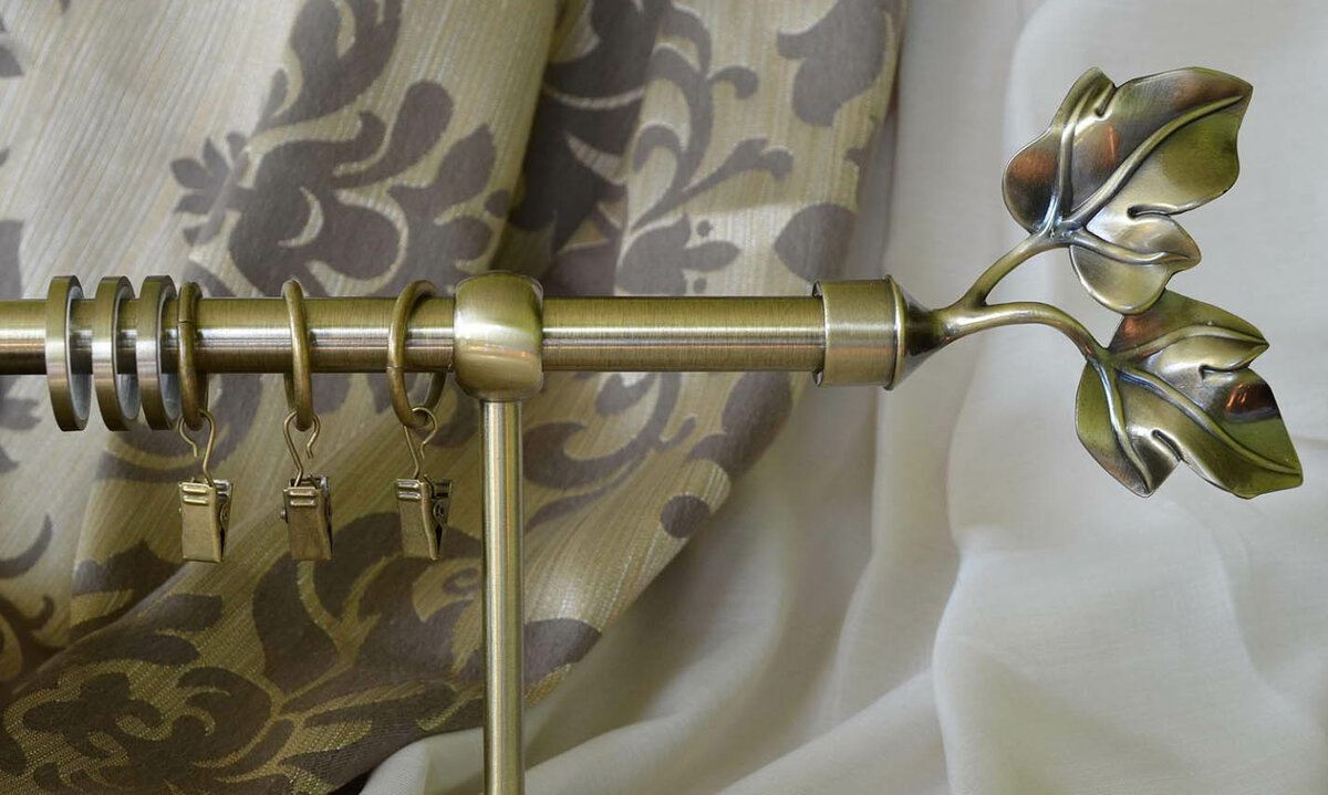 Curtains Rods: Types, Production Materials, Fastening Overview. Purple embroidered curtains and steel gilded rod